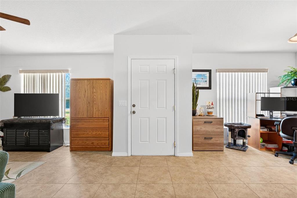 3859 Southwest 109th Lane Ocala, FL 34476 - Photo 4 of 55 a view of livingroom with furniture and a flat screen tv