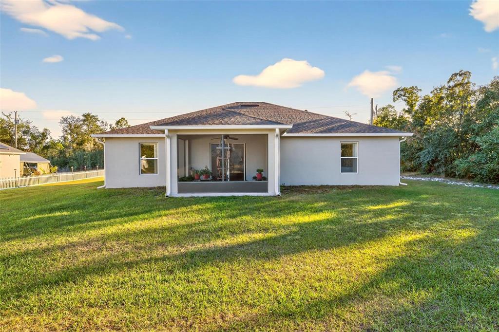 3859 Southwest 109th Lane Ocala, FL 34476 - Photo 46 of 55 a view of a house with a backyard