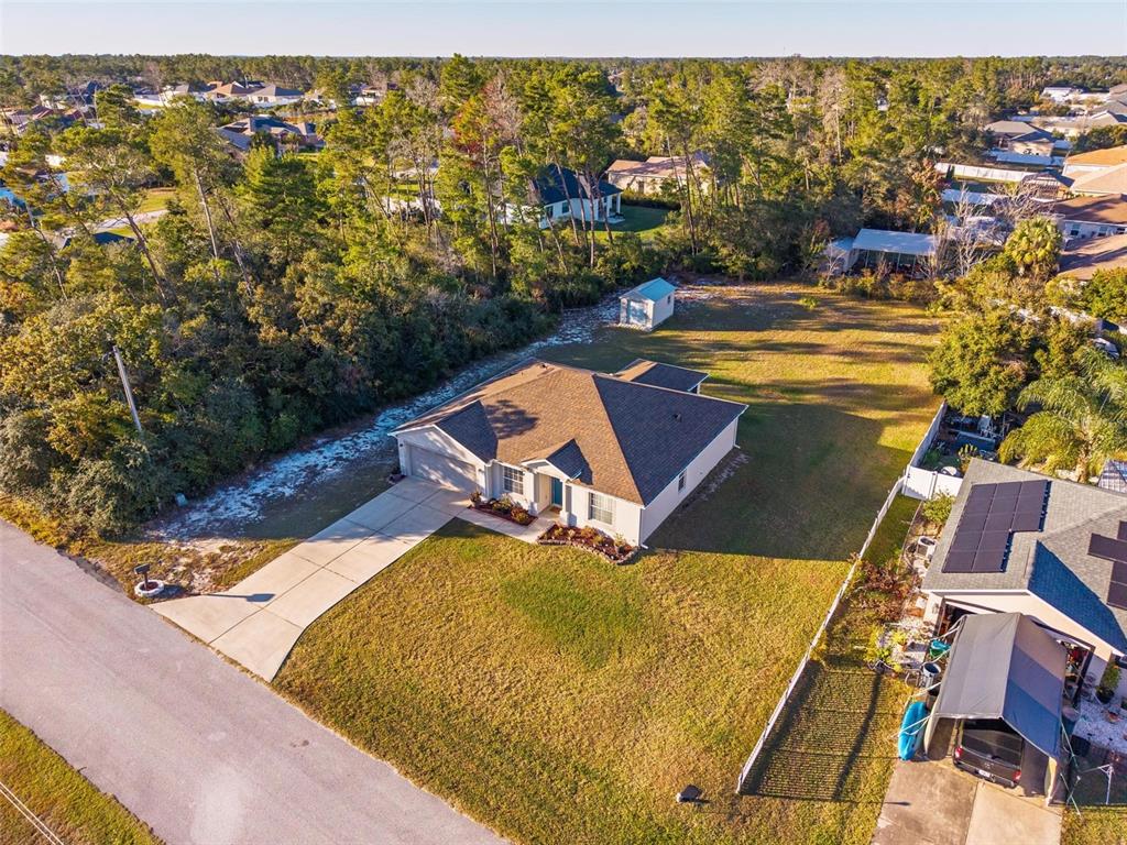 3859 Southwest 109th Lane Ocala, FL 34476 - Photo 50 of 55 a view of a swimming pool with a lawn chairs