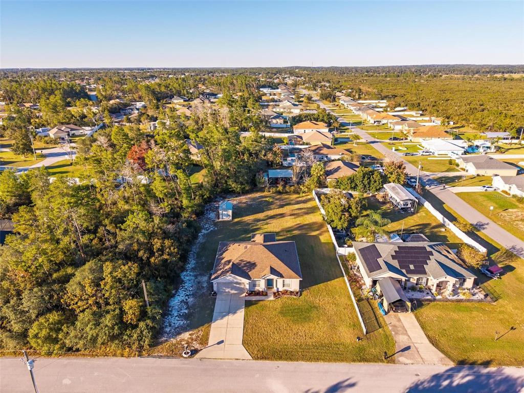 3859 Southwest 109th Lane Ocala, FL 34476 - Photo 52 of 55 an aerial view of residential houses with outdoor space
