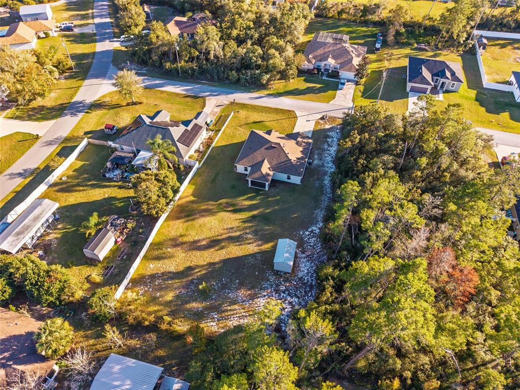 3859 Southwest 109th Lane Ocala, FL 34476 - Photo 53 of 55 an aerial view of residential houses with outdoor space