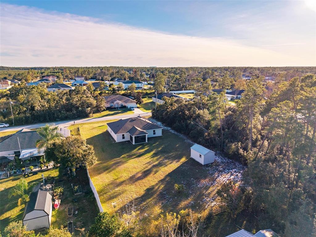 3859 Southwest 109th Lane Ocala, FL 34476 - Photo 54 of 55 an aerial view of residential houses with outdoor space