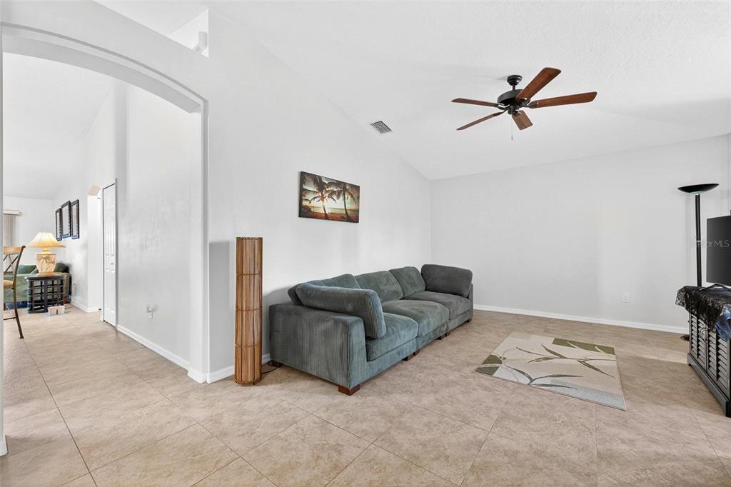 3859 Southwest 109th Lane Ocala, FL 34476 - Photo 6 of 55 a living room with furniture and a rug
