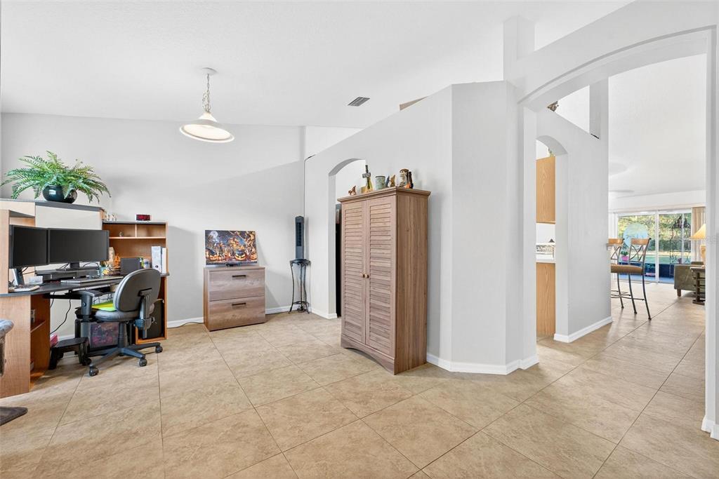 3859 Southwest 109th Lane Ocala, FL 34476 - Photo 7 of 55 a view of a livingroom with workspace and a window