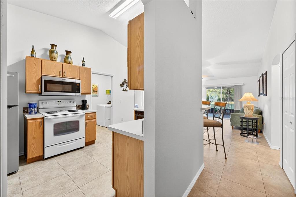 3859 Southwest 109th Lane Ocala, FL 34476 - Photo 9 of 55 a kitchen with stainless steel appliances a stove a microwave and a refrigerator