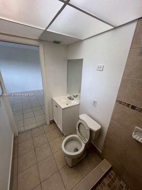 8700 Southwest 133rd Avenue Road, Unit 314 Miami, FL 33183 - Photo 13 of 18 a white toilet sitting next to a bathroom sink and vanity