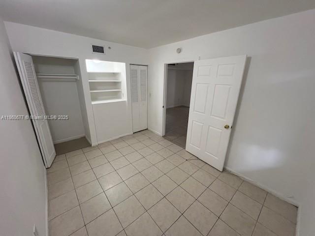 8700 Southwest 133rd Avenue Road, Unit 314 Miami, FL 33183 - Photo 5 of 18 a view of an empty room and closet area