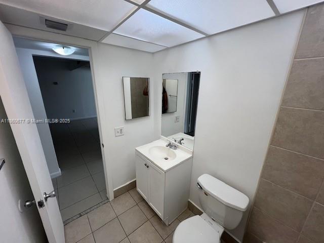 8700 Southwest 133rd Avenue Road, Unit 314 Miami, FL 33183 - Photo 8 of 18 a bathroom with a toilet sink and mirror