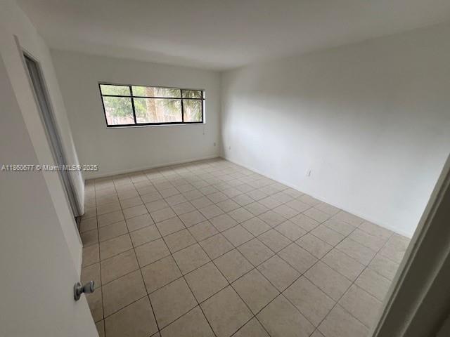8700 Southwest 133rd Avenue Road, Unit 314 Miami, FL 33183 - Photo 10 of 18 a view of an empty room and window