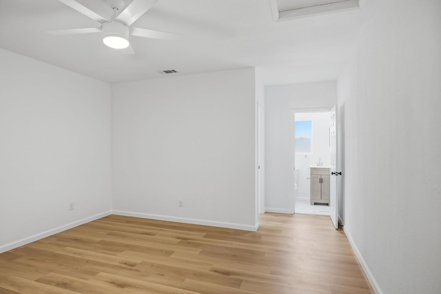 1451 Kent Way Modesto, CA 95355 - Photo 29 of 37 a view of an empty room with wooden floor