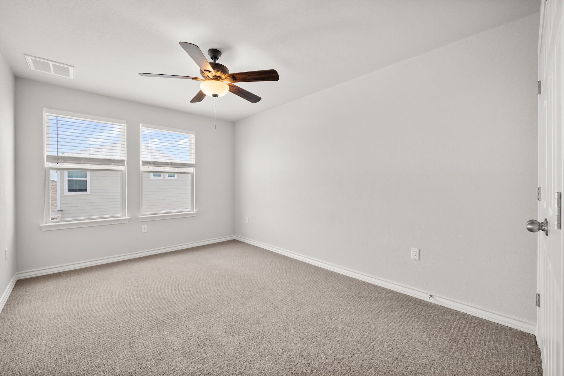 5107 Lemon Tree Path, Unit 127 Austin, TX 78723 - Photo 29 of 40 an empty room with windows and fan