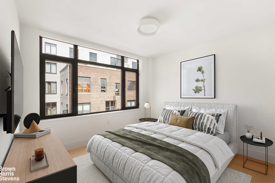 131 Devoe Street, Unit 4C Brooklyn, NY 11211 - Photo 3 of 10 a bedroom with furniture and windows