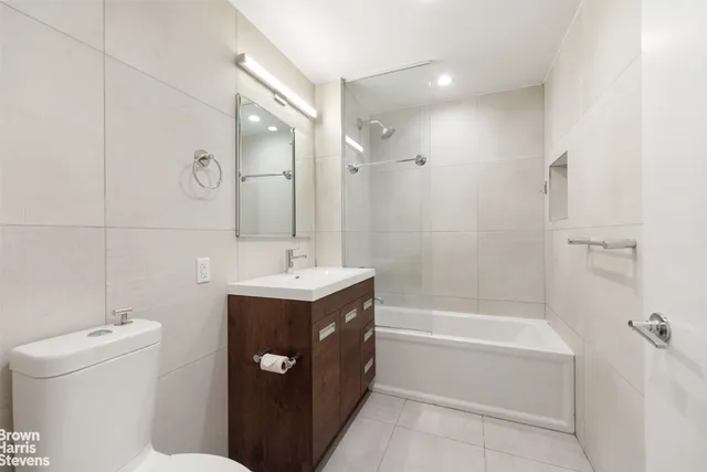 a bedroom with furniture and windows