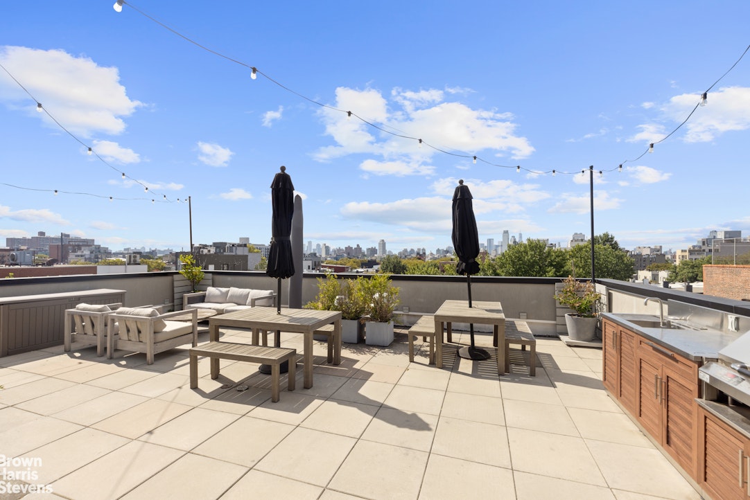 131 Devoe Street, Unit 4C Brooklyn, NY 11211 - Photo 6 of 10 a view of roof deck with patio