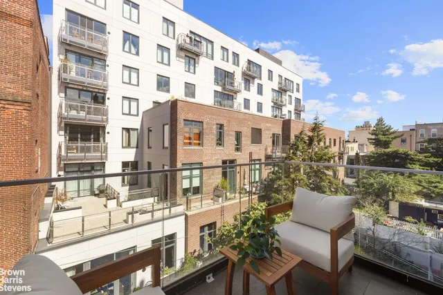 a view of roof deck with patio