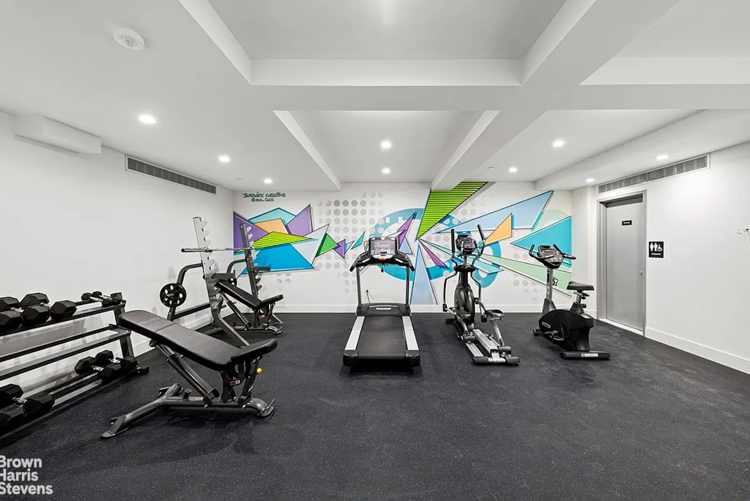 131 Devoe Street, Unit 4C Brooklyn, NY 11211 - Photo 8 of 10 a room with gym equipment