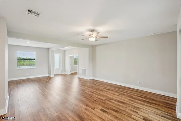 a view of an empty room with a window