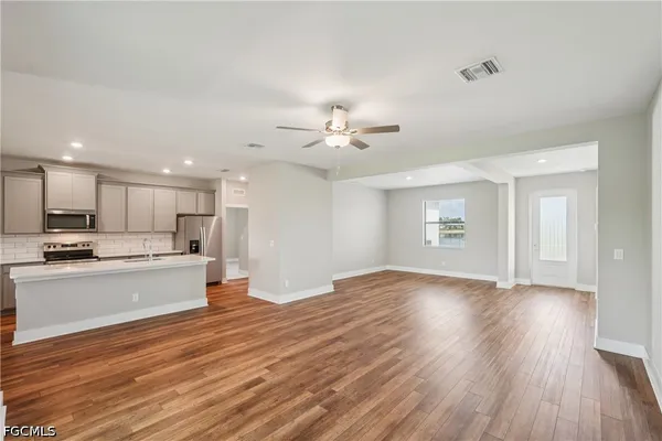 a view of a backyard with plants and a garden