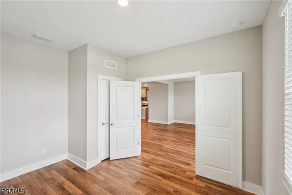 a view of an empty room with a window