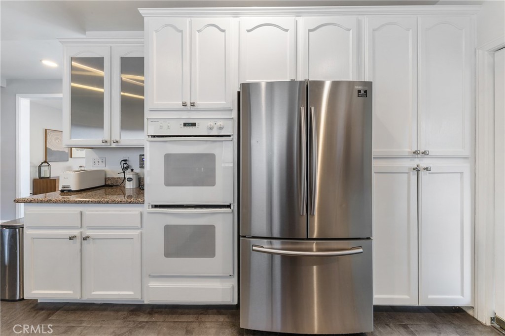 1842 Balboa Way Upland, CA 91784 - Photo 15 of 70 a kitchen with stainless steel appliances a refrigerator and cabinets