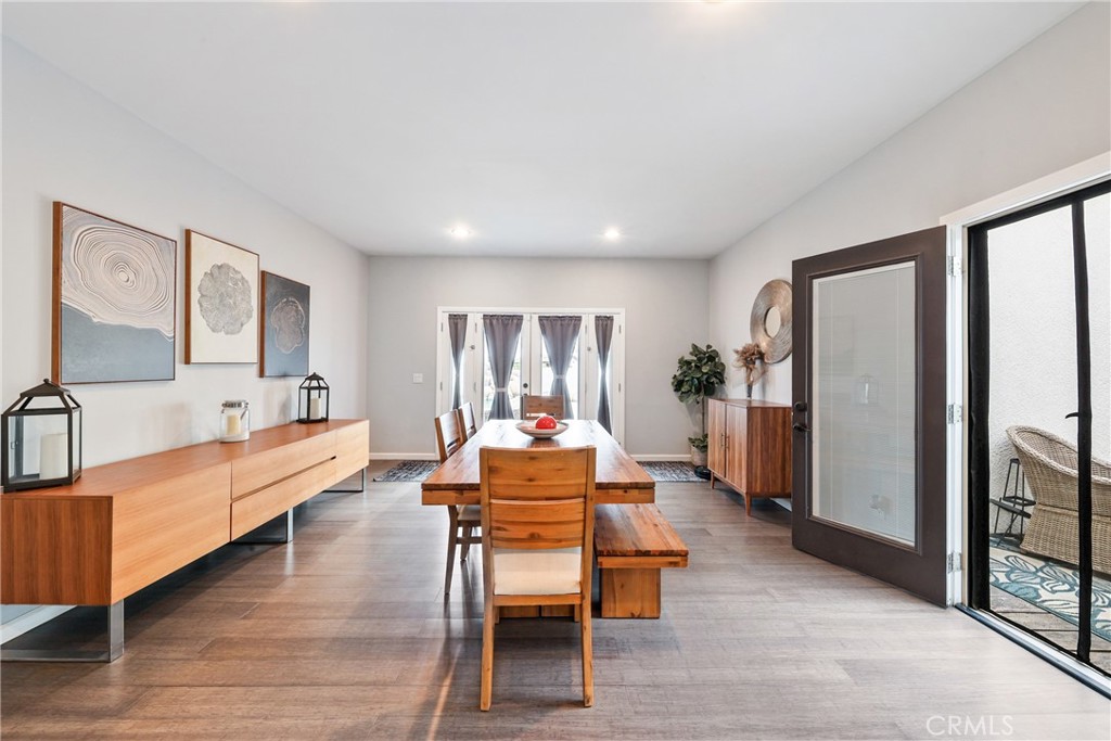 1842 Balboa Way Upland, CA 91784 - Photo 23 of 70 a dining room with furniture a flat screen tv and a large window