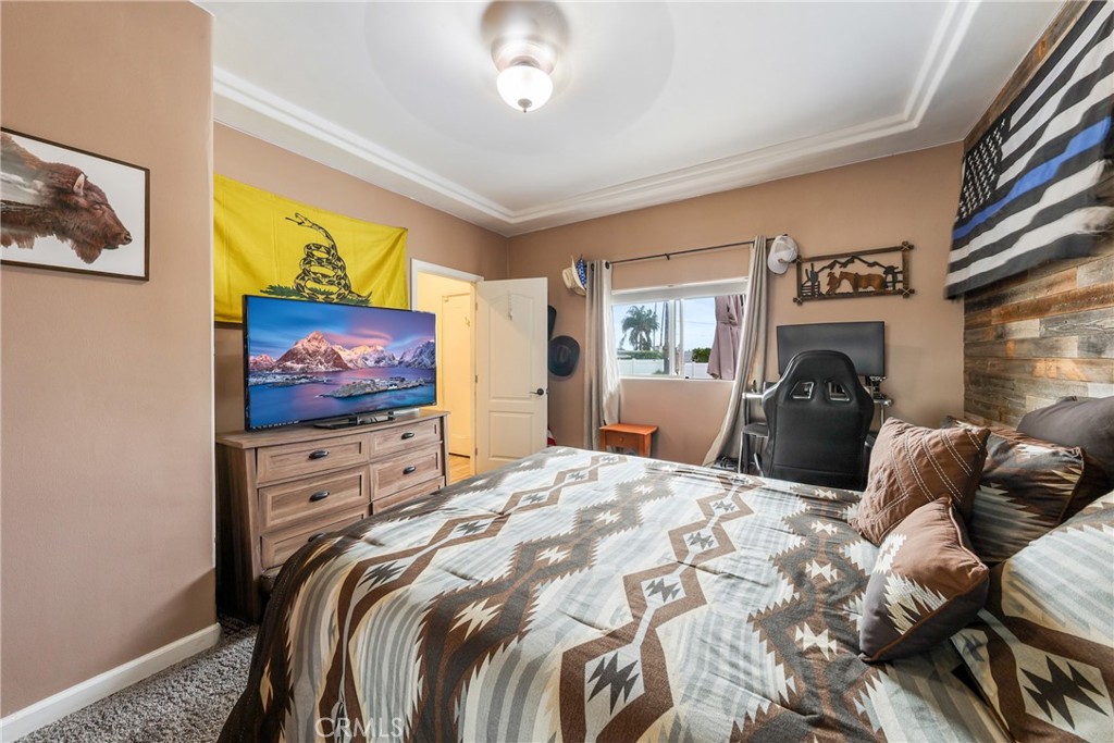 1842 Balboa Way Upland, CA 91784 - Photo 42 of 70 a bedroom with a bed and a flat screen tv