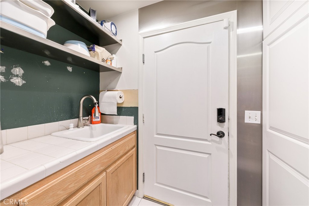 1842 Balboa Way Upland, CA 91784 - Photo 45 of 70 a bathroom with a sink and a mirror