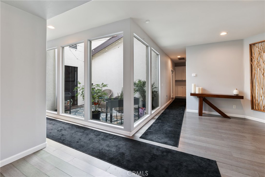 1842 Balboa Way Upland, CA 91784 - Photo 8 of 70 a view of a hallway with wooden floor and glass door