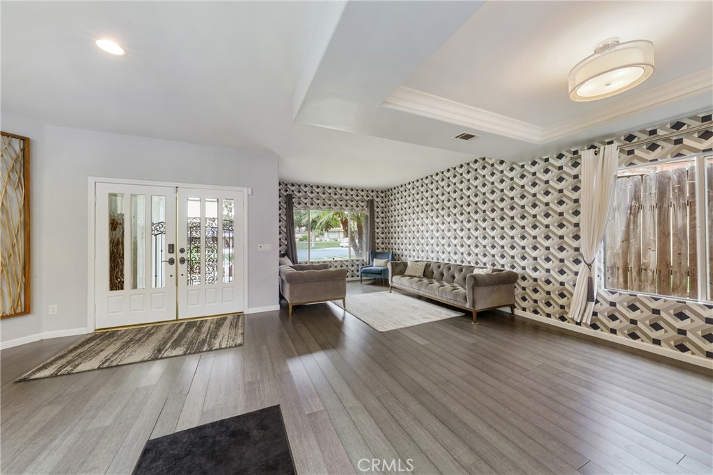 1842 Balboa Way Upland, CA 91784 - Photo 9 of 70 a view of an empty room with a window and wooden floor