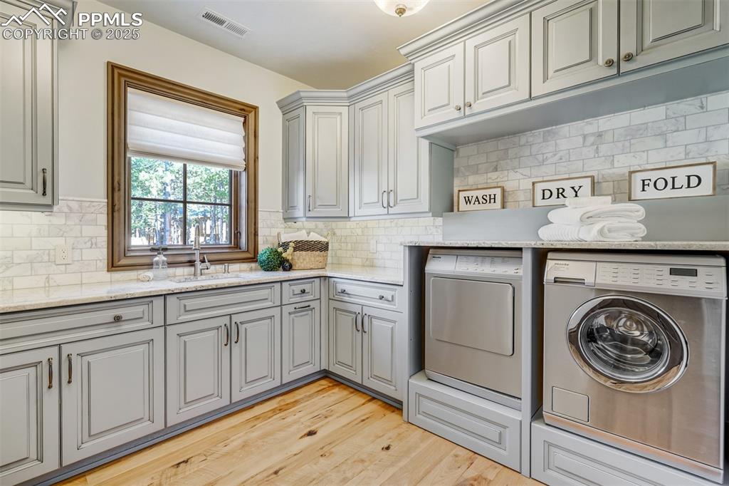 4602 High Forest Road Colorado Springs, CO 80908 - Photo 34 of 50 a kitchen with white cabinets and white appliances