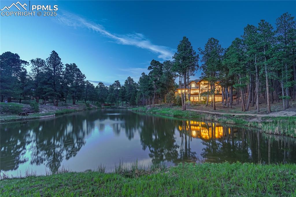 4602 High Forest Road Colorado Springs, CO 80908 - Photo 44 of 50 a lake view with a yard