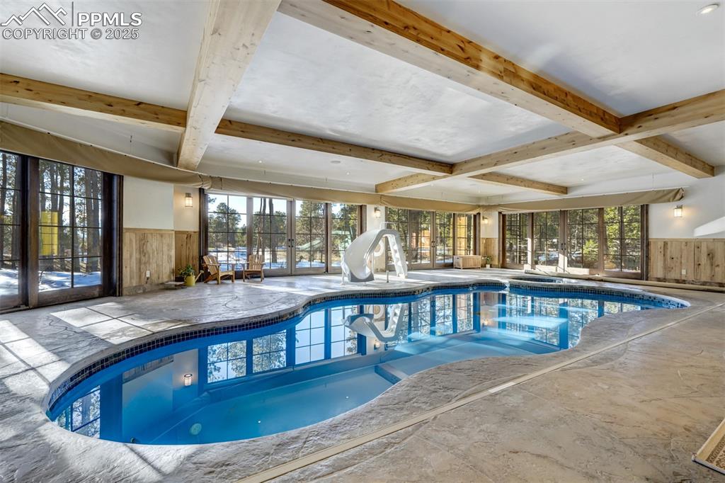 4602 High Forest Road Colorado Springs, CO 80908 - Photo 47 of 50 a view of a swimming pool with a patio
