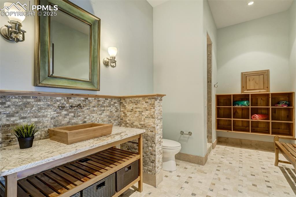 4602 High Forest Road Colorado Springs, CO 80908 - Photo 48 of 50 a bathroom with a sink a toilet and shower