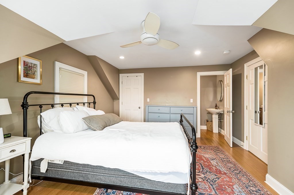 160 Prospect Street, Unit 3 Gloucester, MA 01930 - Photo 11 of 22 a bedroom with a large bed and a rug