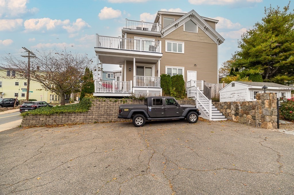 160 Prospect Street, Unit 3 Gloucester, MA 01930 - Photo 15 of 22 a view of a car is parked in front of a building