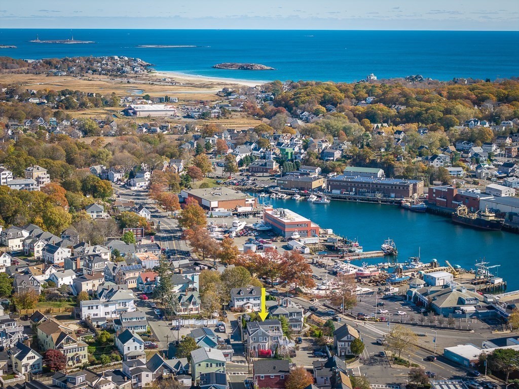 160 Prospect Street, Unit 3 Gloucester, MA 01930 - Photo 22 of 22 an aerial view of ocean and residential houses with outdoor space