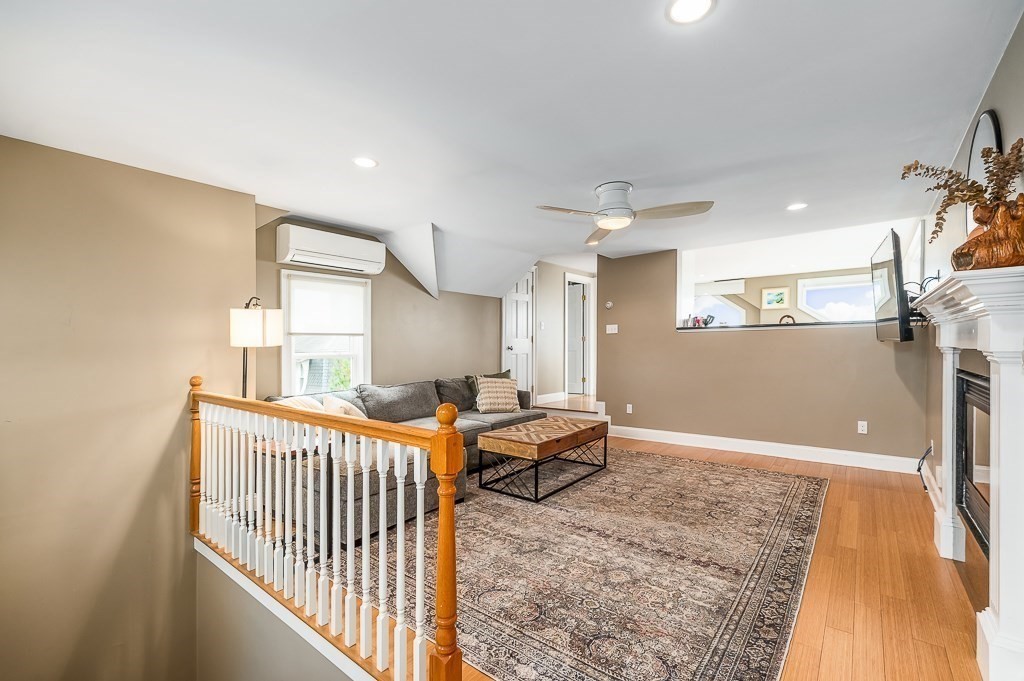 160 Prospect Street, Unit 3 Gloucester, MA 01930 - Photo 5 of 22 a bedroom with furniture and a window
