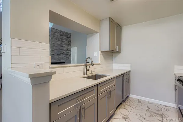 a kitchen with a sink and cabinets