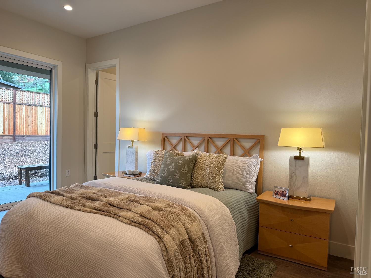 1901 Carlile Place Santa Rosa, CA 95403 - Photo 11 of 29 a bedroom with a bed and a lamp