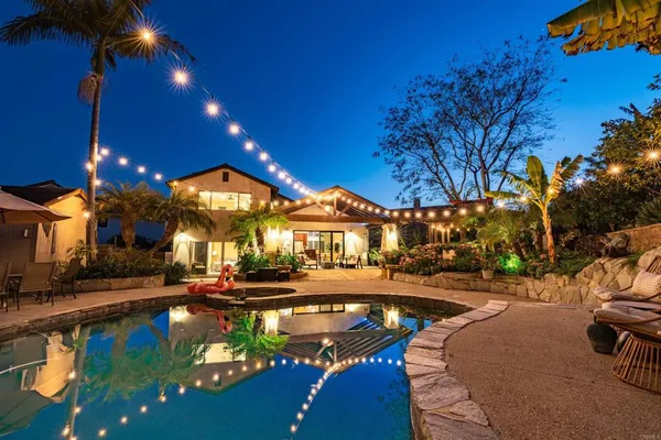 a view of a swimming pool with an outdoor seating