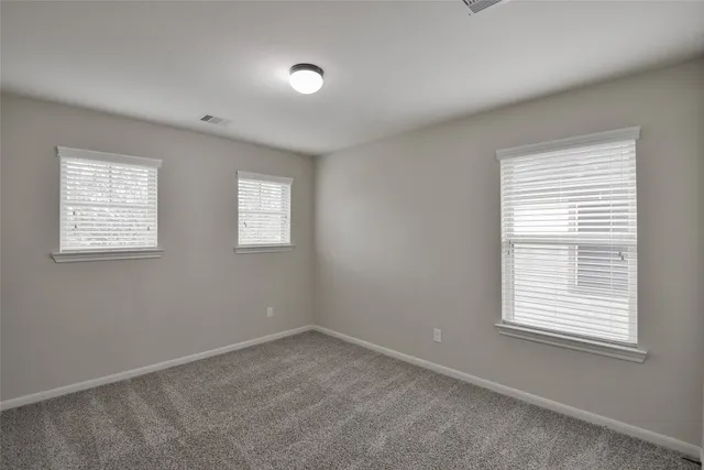 a view of a room that has a window in it