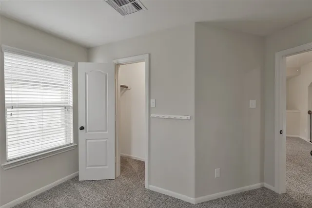 a view of a hallway with windows
