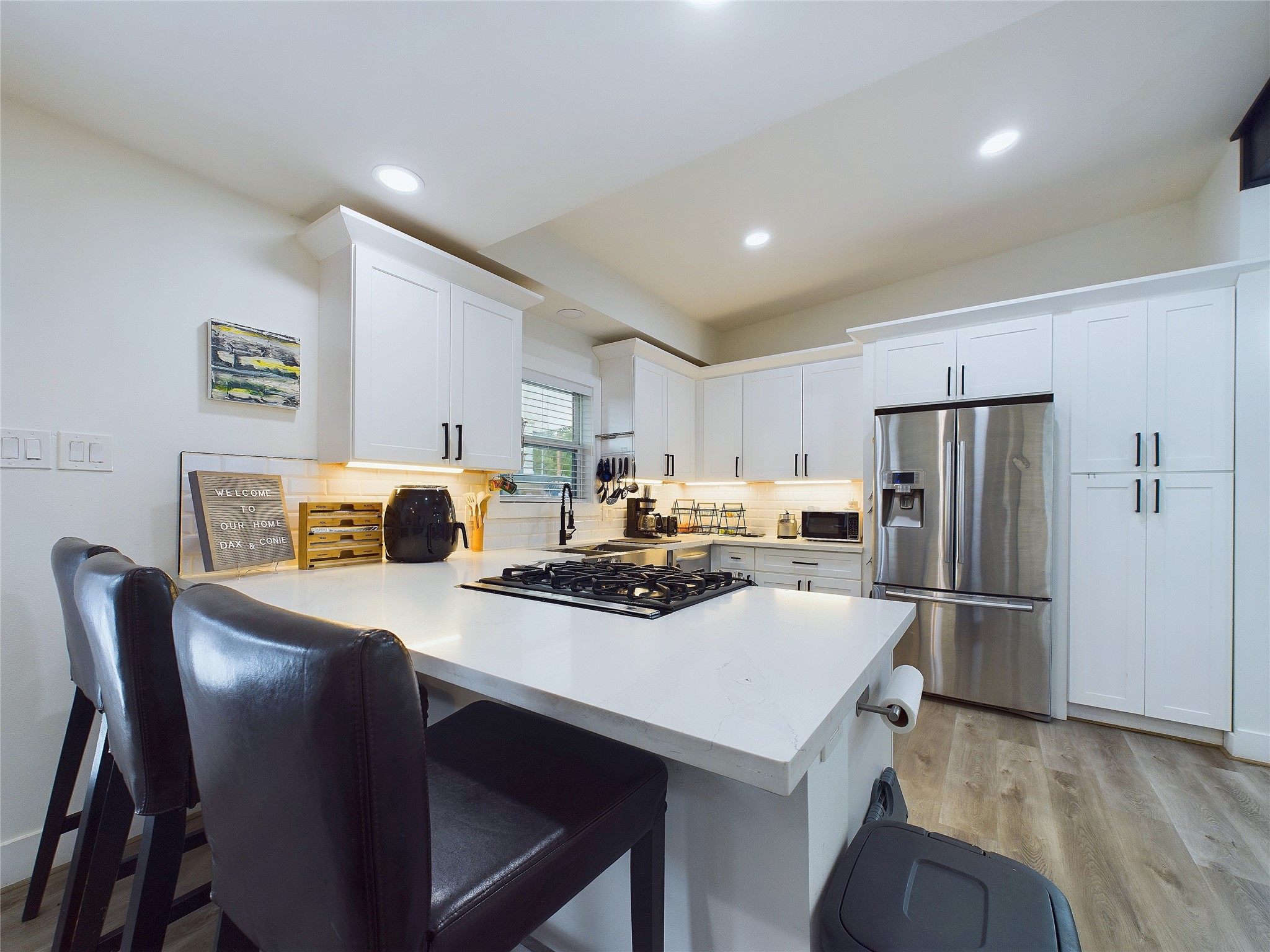 7609 Amelia Road Houston, TX 77055 - Photo 8 of 29 Sit at this counter in this updated kitchen