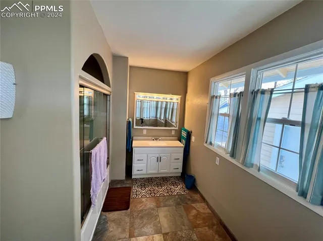 a kitchen with stainless steel appliances granite countertop a stove and a refrigerator