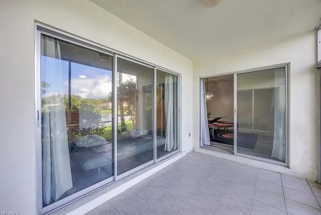 a view of a room with a large window