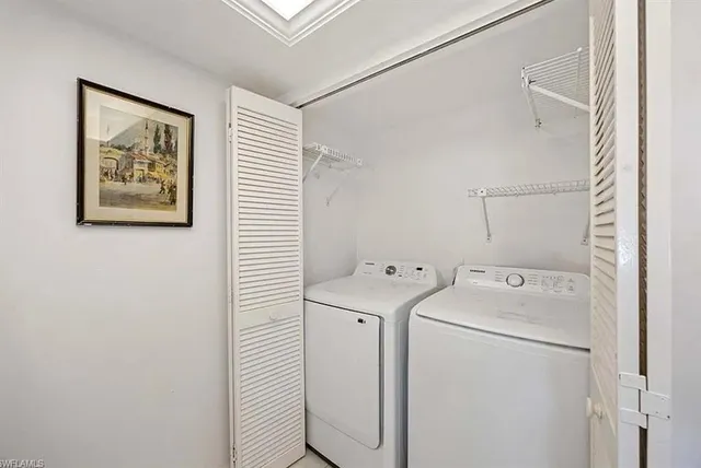 a utility room with dryer and washer
