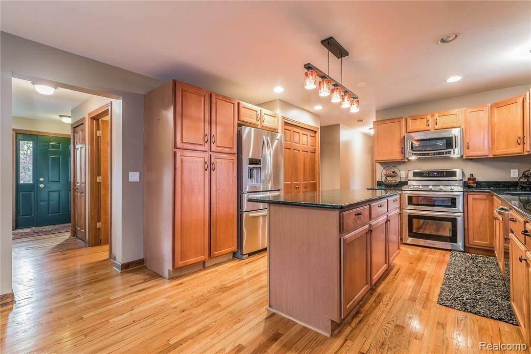 277 North Baldwin Road Oxford, MI 48371 - Photo 11 of 45 LEADS TO FOYER, 1/2 BATH, MASTER SUITE, LAUNDRY, & SIDE ENTRANCE