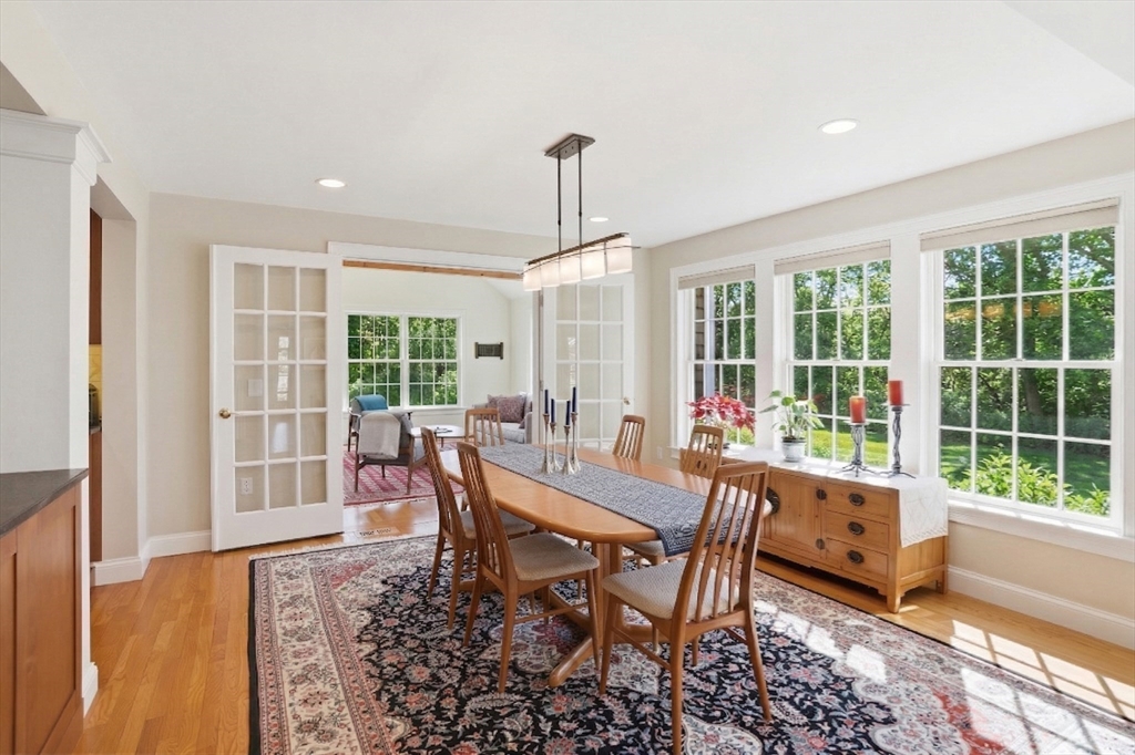 25 Bold Meadow Road Edgartown, MA 02539 - Photo 13 of 40 a dining room with furniture a chandelier and wooden floor