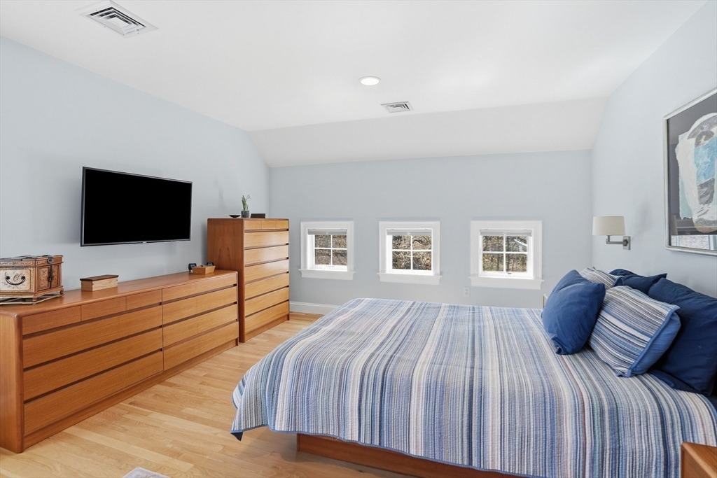 25 Bold Meadow Road Edgartown, MA 02539 - Photo 17 of 40 a bedroom with a bed and a flat screen tv