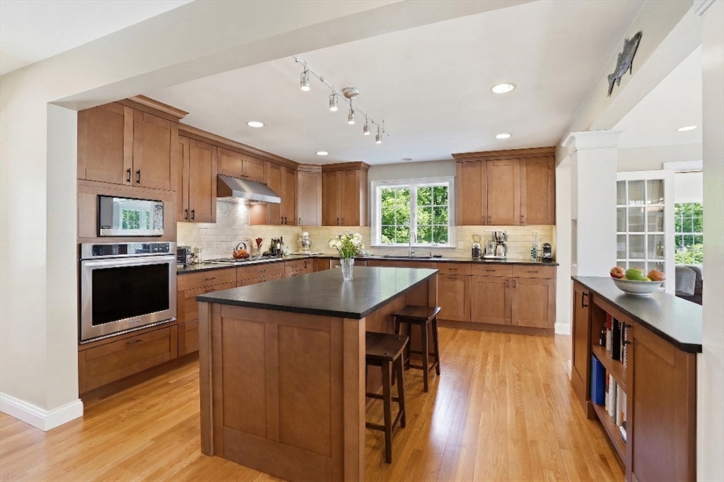 25 Bold Meadow Road Edgartown, MA 02539 - Photo 2 of 40 a kitchen with stainless steel appliances granite countertop sink stove refrigerator and cabinets